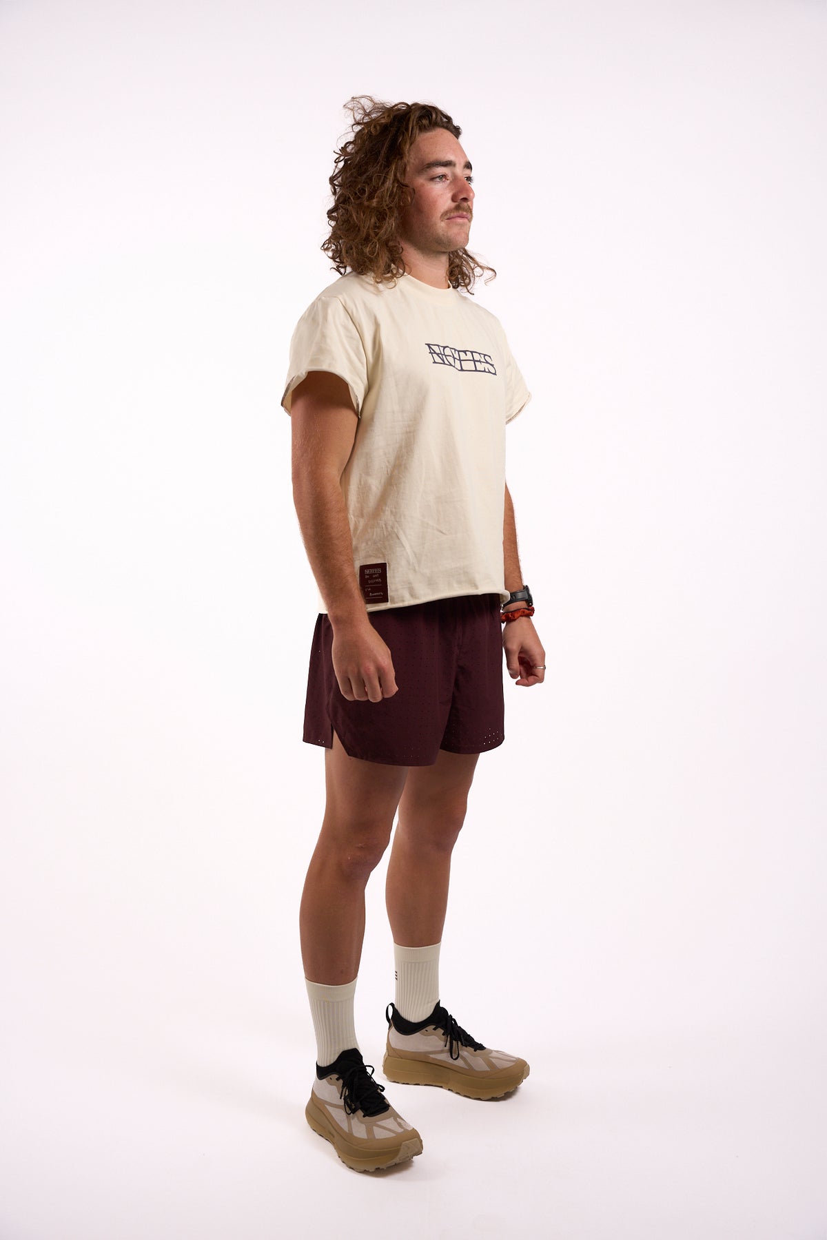 Anniversary Tee in off white, full length on model, side view