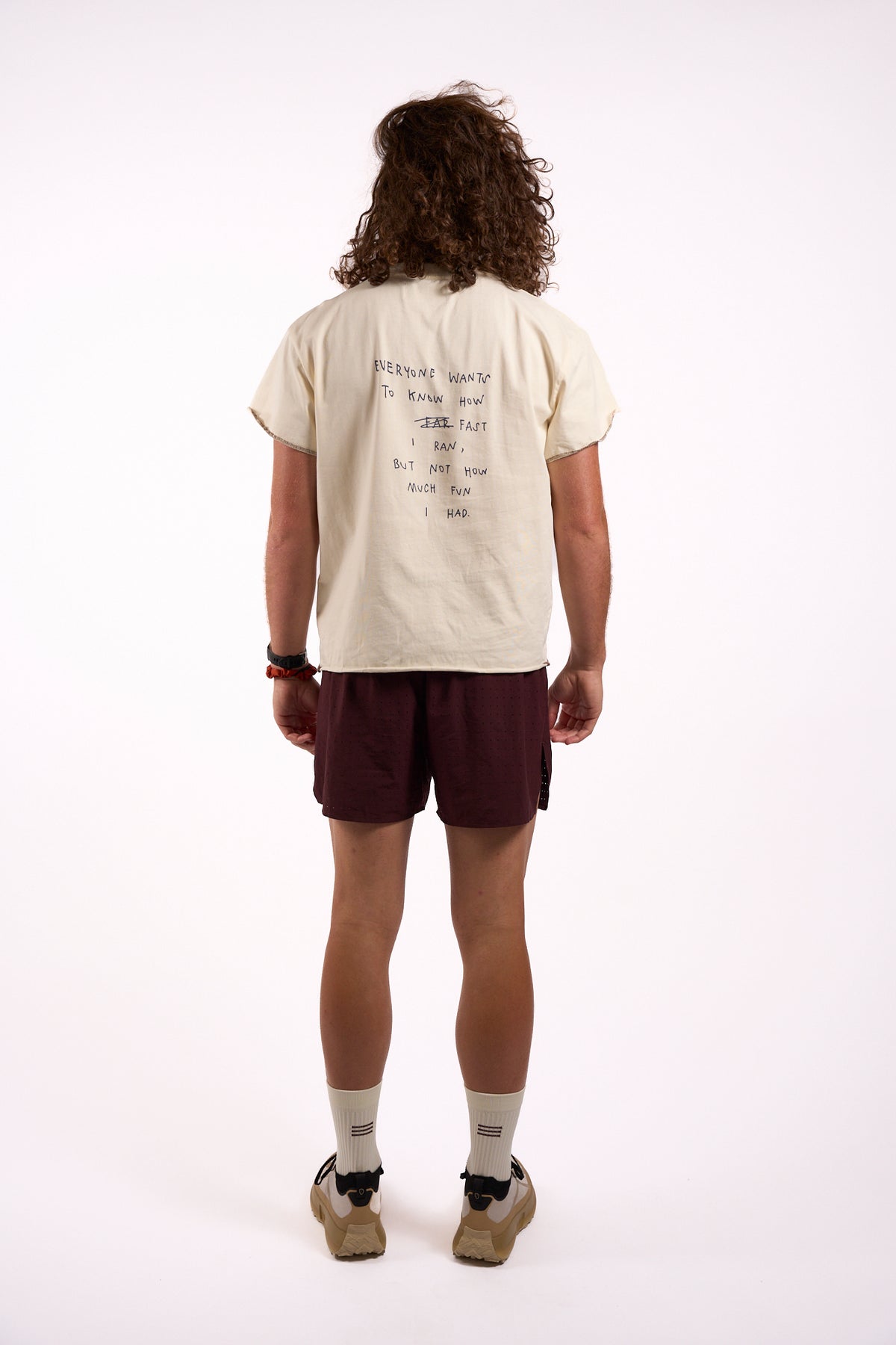 Anniversary Tee in off white, full length on model, back print