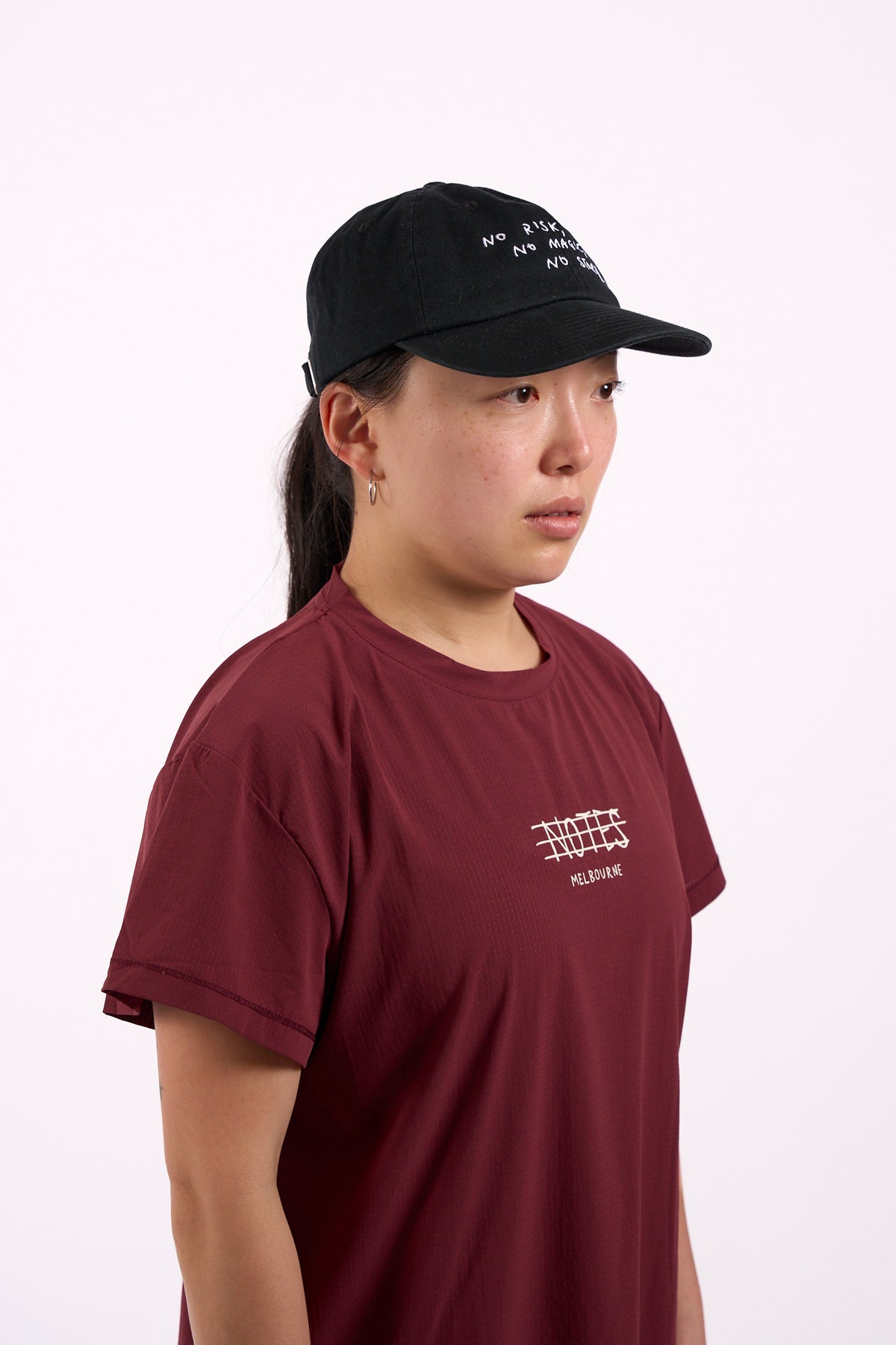 No Risk No Magic No Story cap in washed black, on model, side view