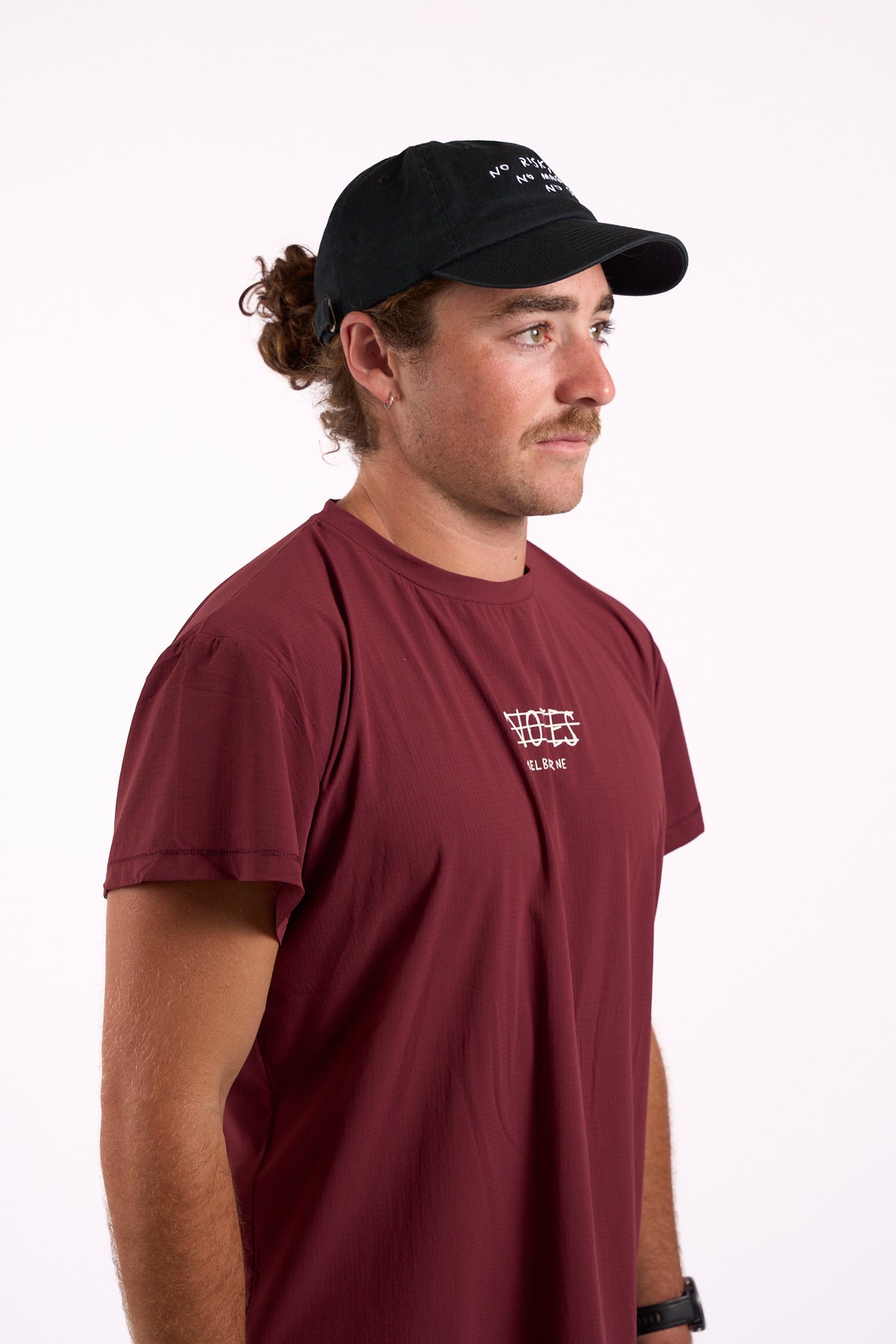 No Risk No Magic No Story cap in washed black, on model, side view