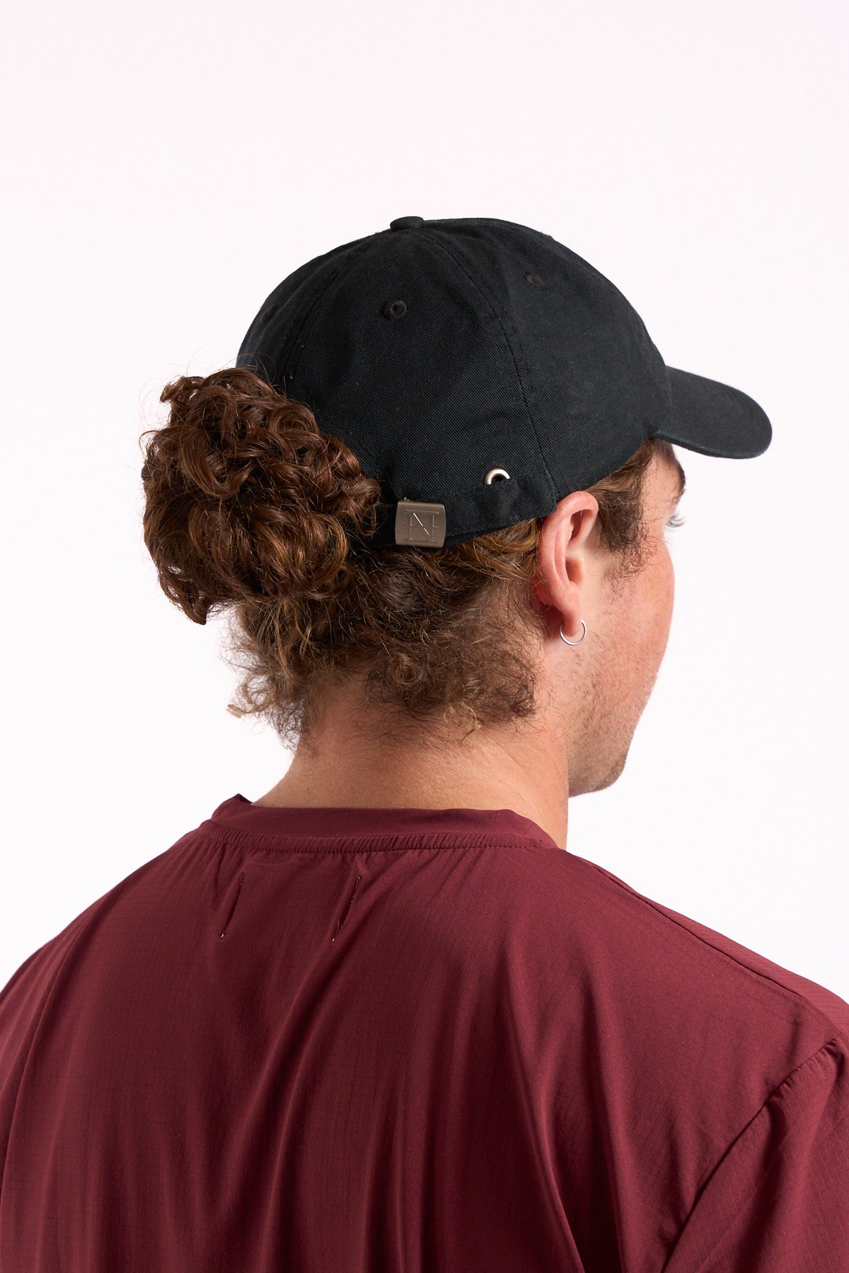 No Risk No Magic No Story cap in washed black, on model, back view showing strap
