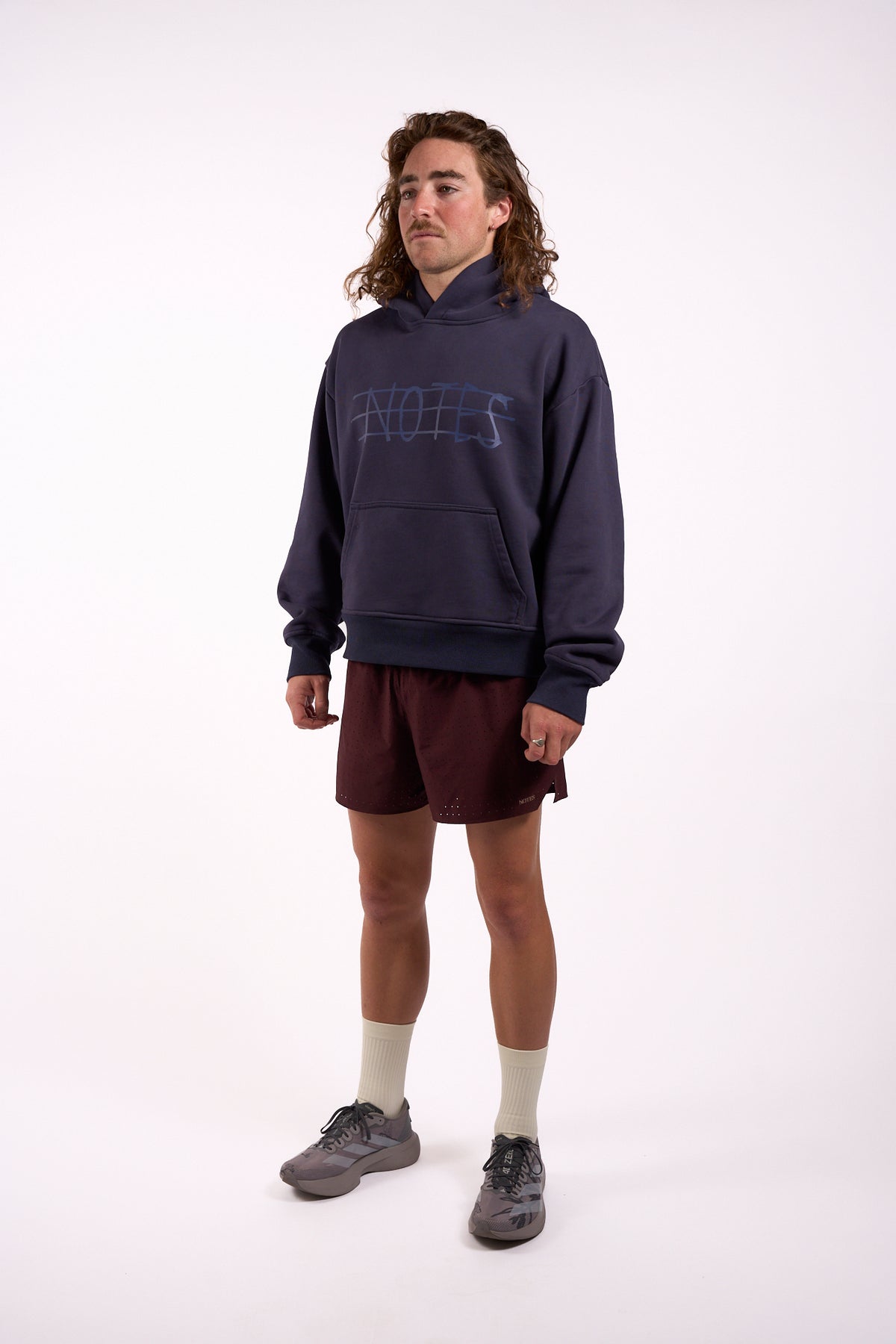 Warm Down Hoodie in Washed Pelagic Blue, full length on model, front three-quarter view