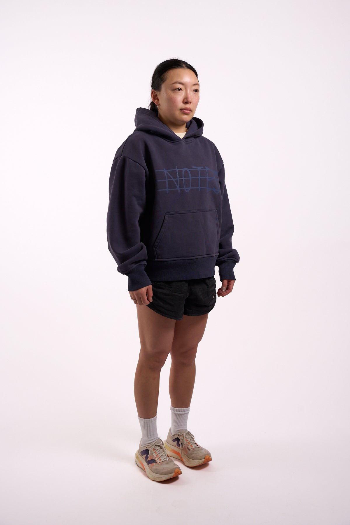 Warm Down Hoodie in Washed Pelagic Blue, full length on model, front three-quarter view