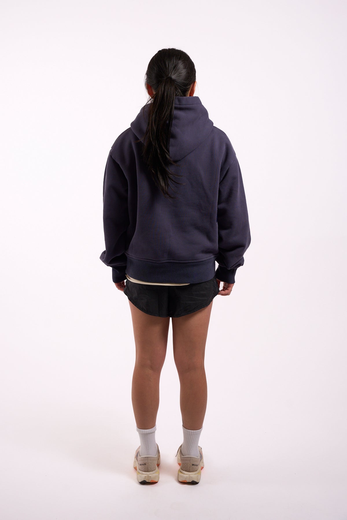 Warm Down Hoodie in Washed Pelagic Blue, full length on model, back view