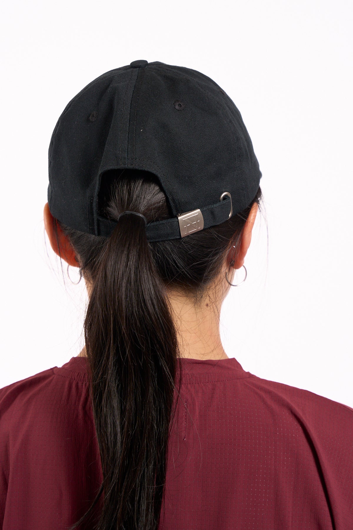 No Risk No Magic No Story cap in washed black, on model, back view showing strap